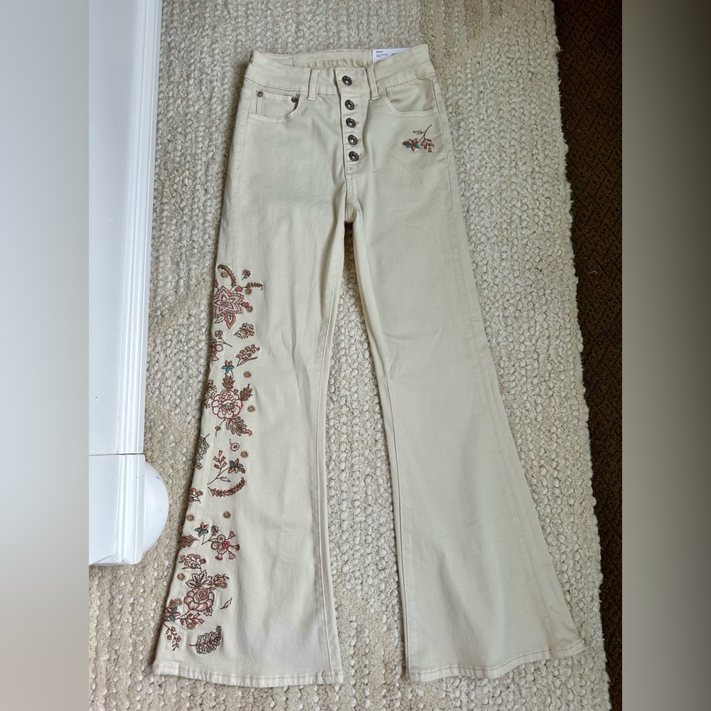 Darling high rise, super flare embroidered cream jeans!